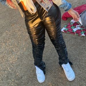 Black leather stacked pants